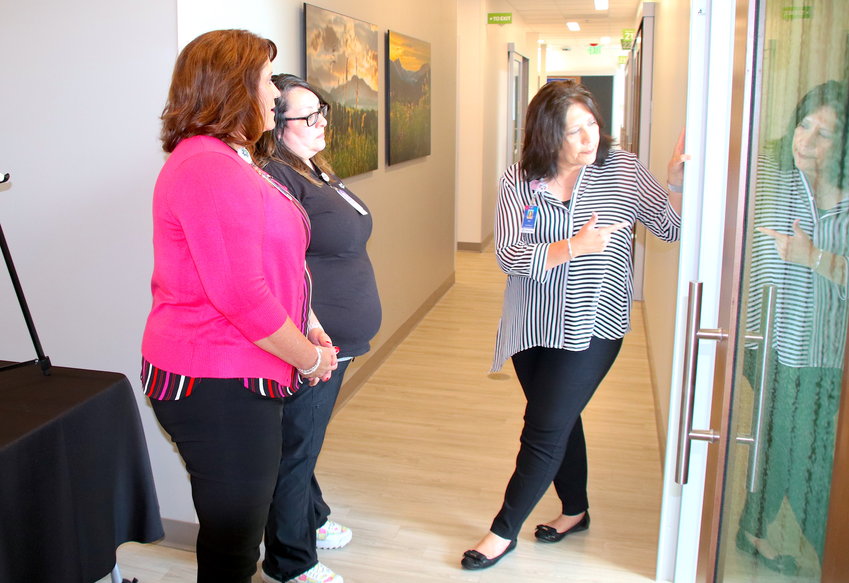 Platte Valley Medical Center President Jaime Campbell, left, and Medical Assistant Heather Donnelly listen as Practice Manager Barb Trujillo leads a tour of the new Platte Valley Medical Group practice on 50th Ave. in Brighton.